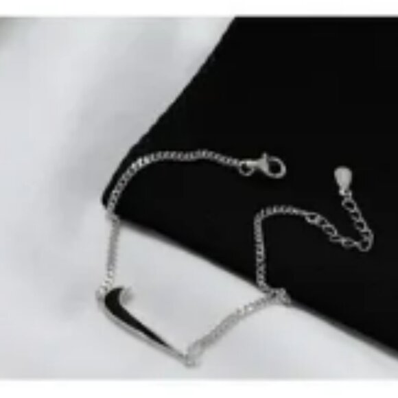 NIKE: Swoosh Bracelet - Picture 1 of 7